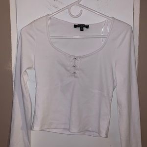 White top with flower clips in front size medium